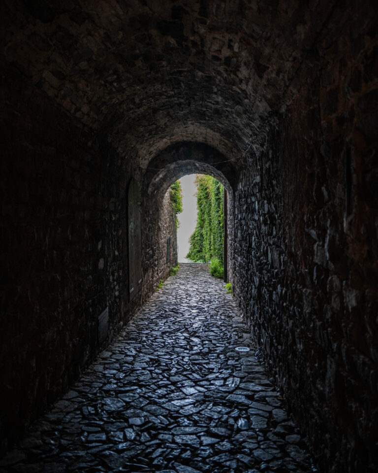 A quiet alleyway carved in stone in the village of Torno, on the shores of Lake Como, Italy.